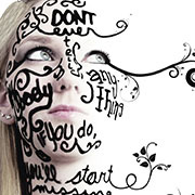 Girl with writing on her face fading.